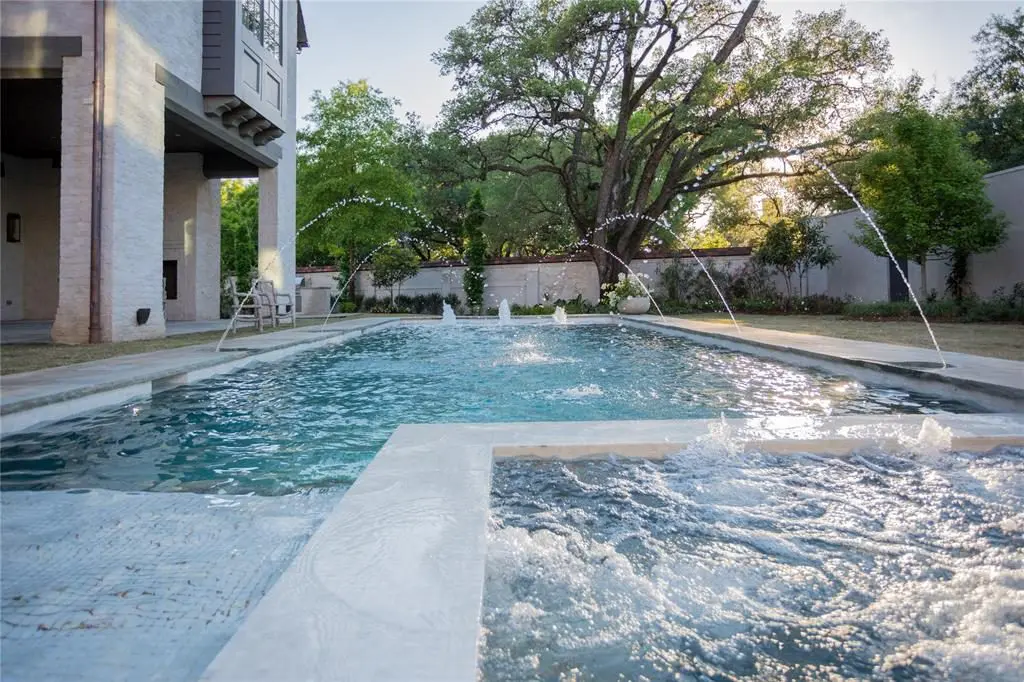 The stylish home comes with both a pool and a spa. 