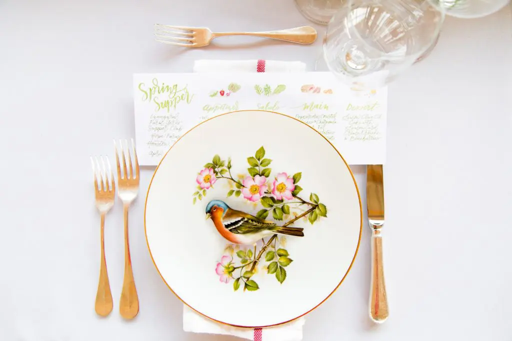 Each place setting featured a different vintage plate procured by Goodie Rentals in Round Top and a watercolor menu by Nancy Bihlmaier of Nancy B. Creative.