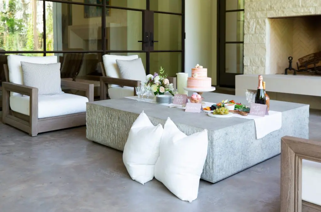 Cocktails and light bites were enjoyed on the terrace in a Bellaire home designed by Marie Flanigan Interiors