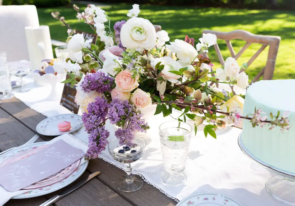 A free-flowing, low and long arrangement by Maxit Flower Design.