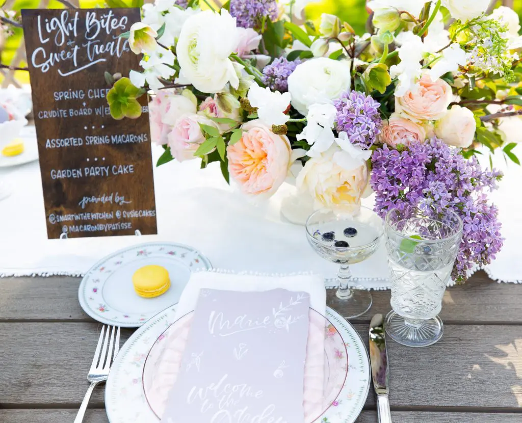 A menu calligraphed on a wood board by Meg Grant & Co adds a rustic touch.