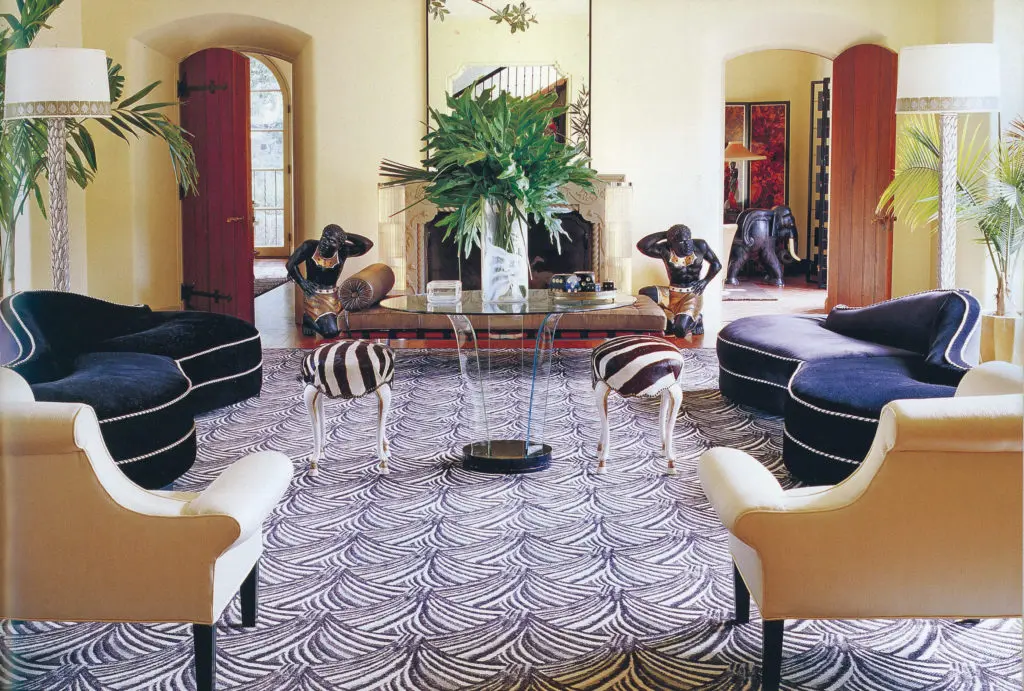 In Rosmarin's symmetrically arranged living room, the stars were a pair of Moderne, velvet-upholstered sofas acquired from a Miami hotel. Judy Robinson Estate Sales will feature these sofas as well as many more museum-worthy decorative arts and furnishings in its auction June 15 through June 18 showcasing the estate of Mickey Rosmarin. (Photo Tria Giovan)    