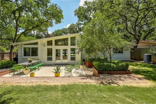 A fenced backyard and stone patio gives 416 Ridgewood a sense of being a retreat.