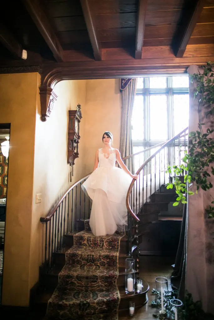 The bride descending the staircase (Photo by Samuel Lippke Studios)