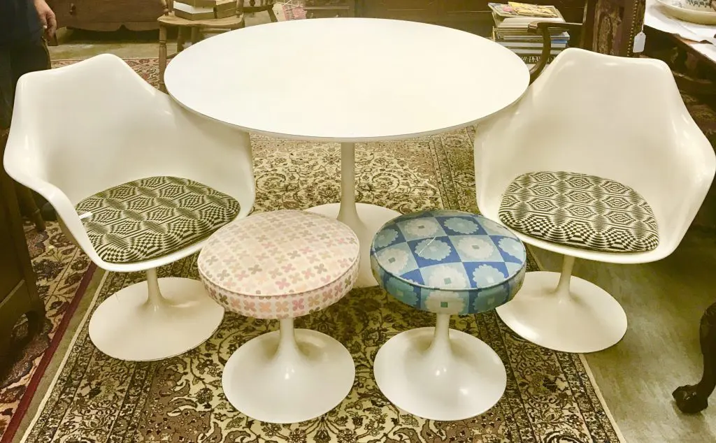Eero Saarinen's tulip chairs, stools, and table for Herman Miller, from the collection of Rosmarin, a devotee of design as well as fashion and art. 
