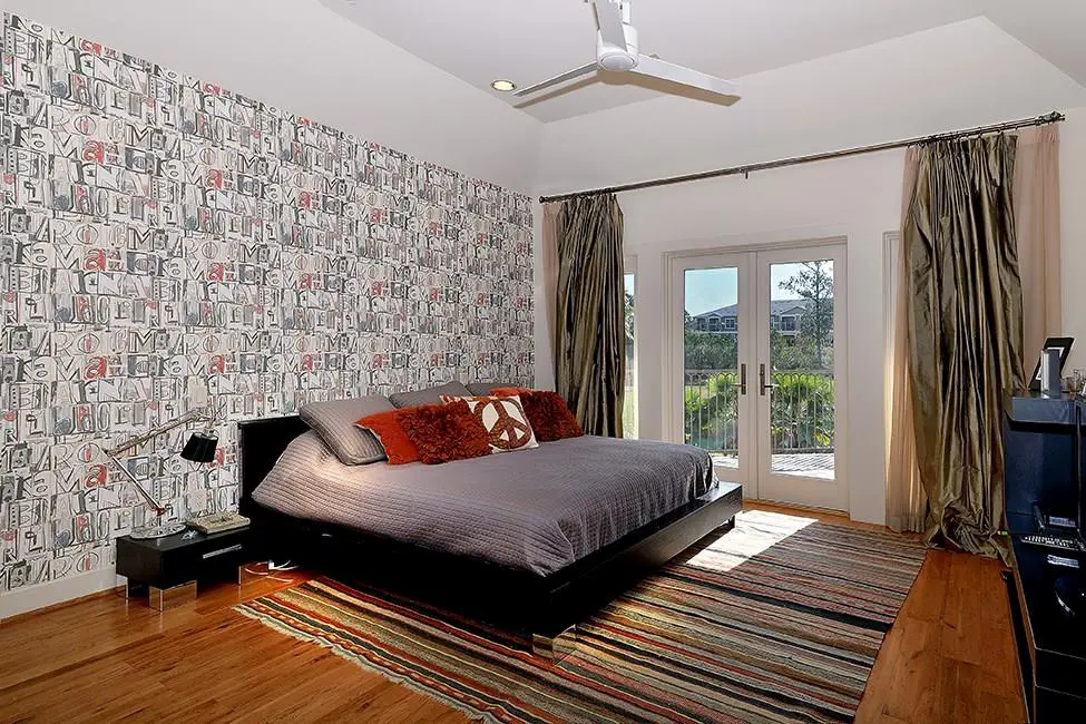 Playful wallpaper shows this bedroom's potential for individuality. 