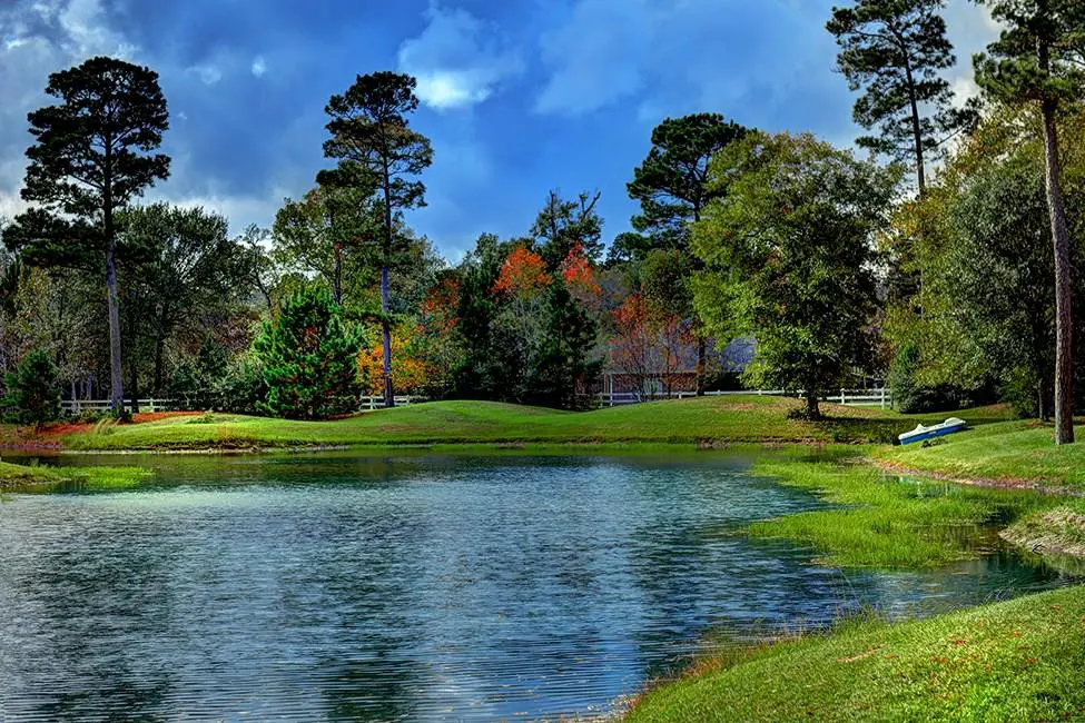 The pristine lake waters surround the home. 