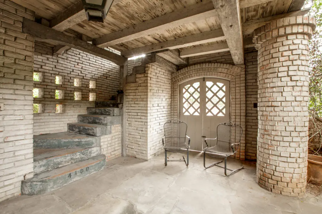 Courtyard of the 1937 Dilbeck duplex on University Blvd. and Preston Rd. shows Dilbeck's masterful interpretation of French farmhouse architecture. Courtesy Ebby Halliday Realtors