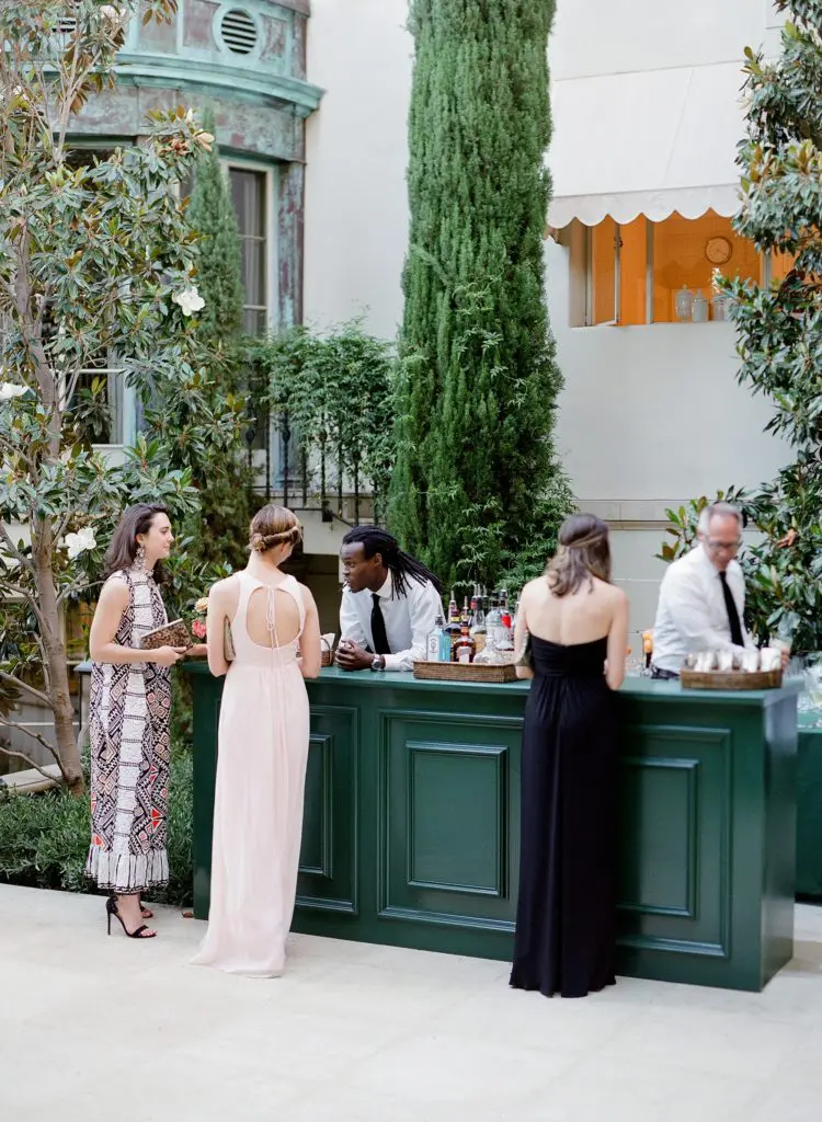 The decor mimicked the house with the high-gloss green of the bar matching exactly to the paint color of the home’s front door. (Photo by Jose Villa)