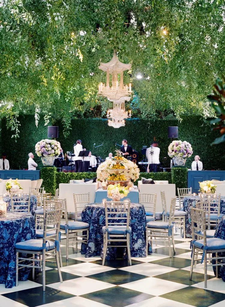 Ashley's mother incorporated family heirlooms and antiques into the garden tent like Antique silver was used to hold large bouquets of dahlias mixed with hydrangea from the garden. (Photo by Jose Villa)