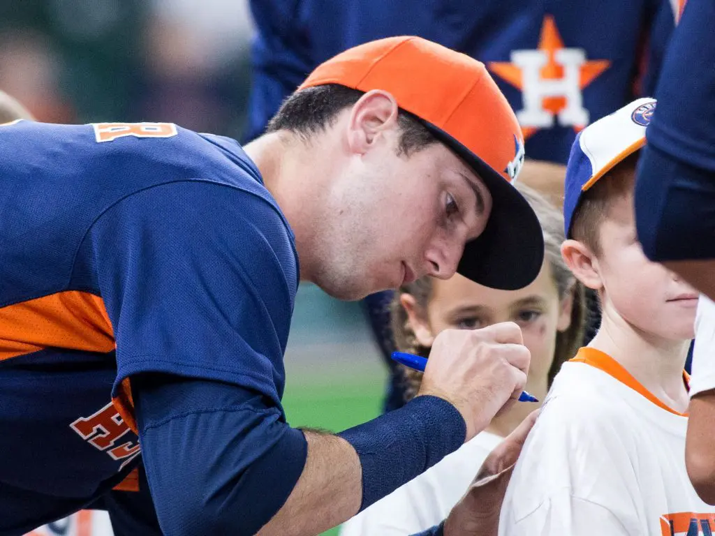 Astros rookie Kyle Tucker signs autographs for the fans. (Photo by F. Carter Smith.)