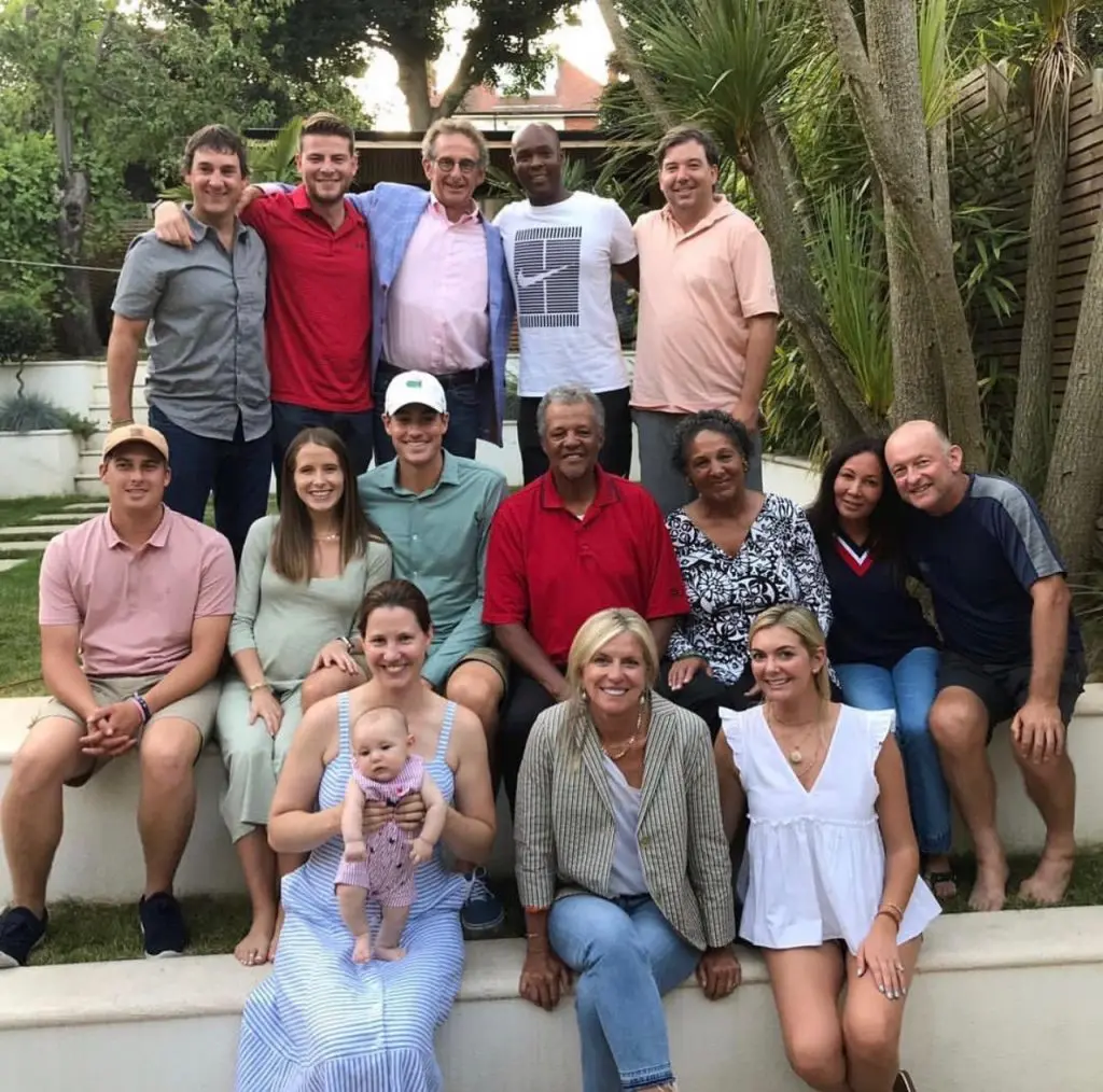 Isner posted this photo to his Instagram account on Saturday of he and Madison surrounded by family and friends in London