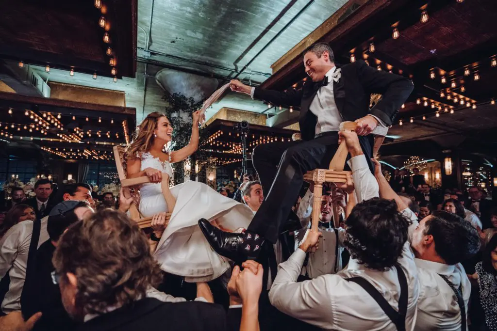 Wedding guests join in the hora with Lauren Weingarten and Oren Marouni. (Photo by Aisha Khan of Ama Photography & Cinema)