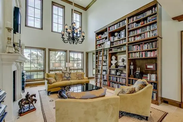 Tall rows of windows let natural light pour into the room. 