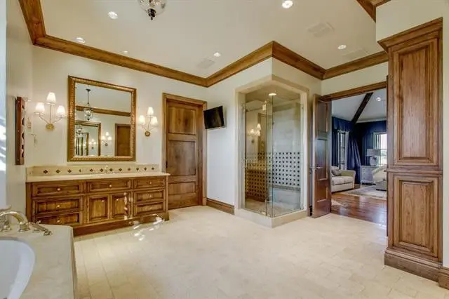 The glass and tile shower is a sleek alternative to the built-in bath. 