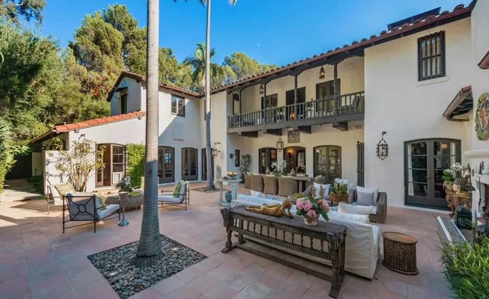 The home is secluded, set high on a hill behind motorized gates. 