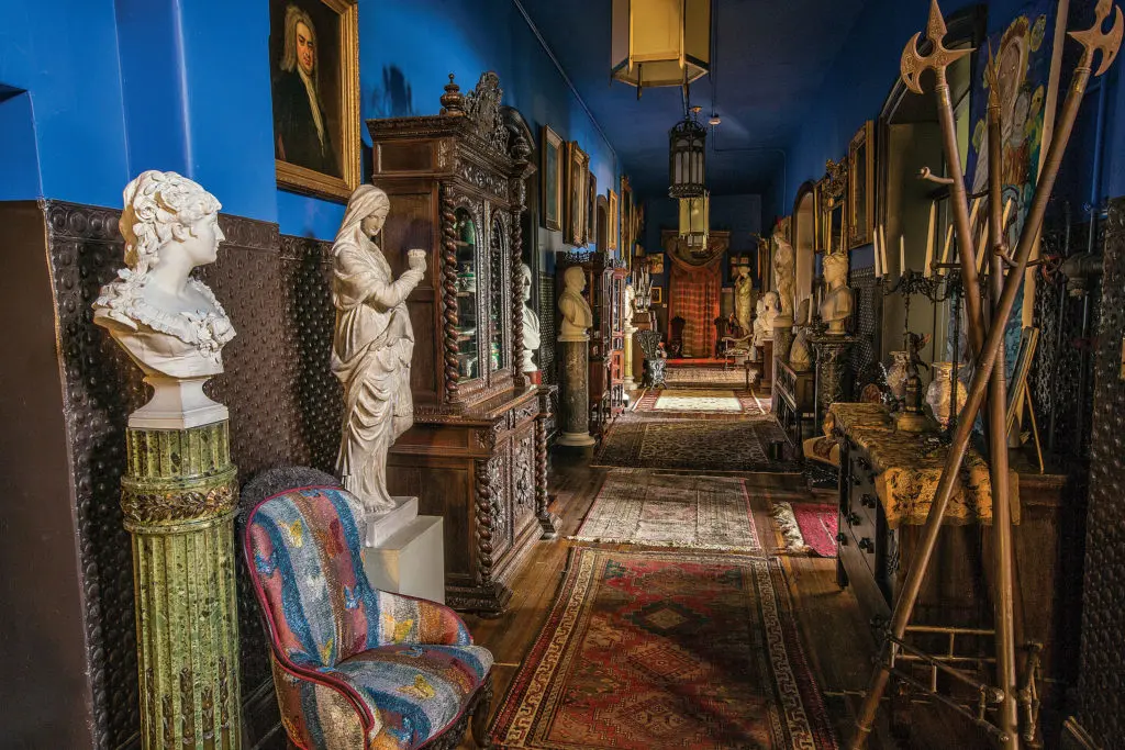 A riot of highly carved 19th-century furniture and busts hold court in the hallway. (Photo Chris Bolton)