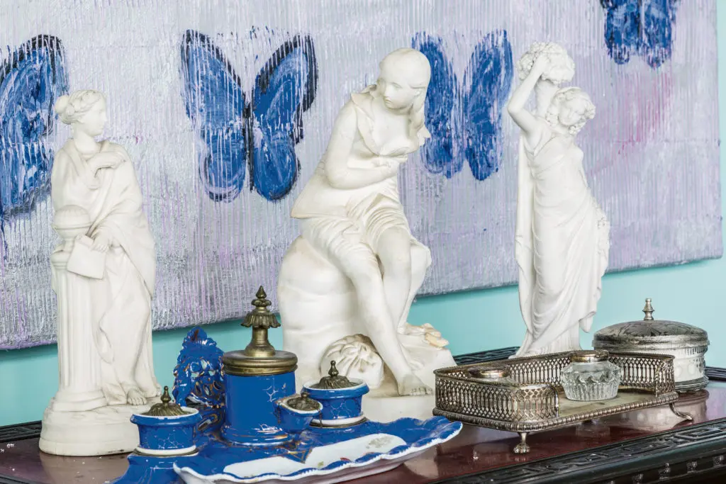 Slonem’s morpho butterfly canvas gazes upon an old Paris inkwell and Parian marble statue. (Photo Marco Ricca)