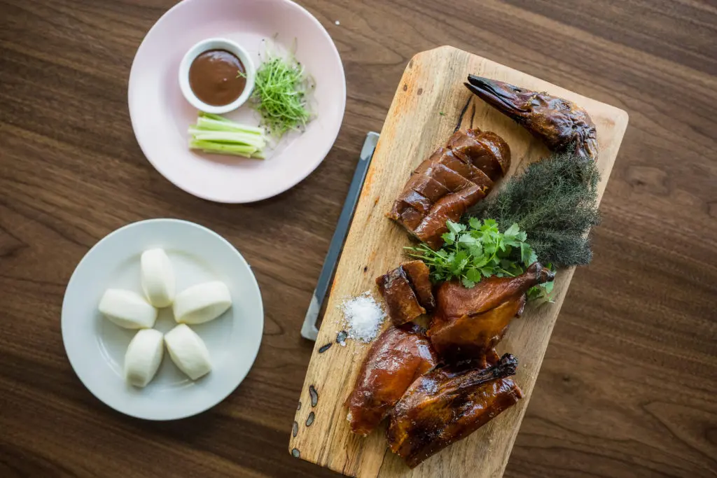 Roasted duck is served with steamed buns and hoisin barbecue sauce at Fine China.