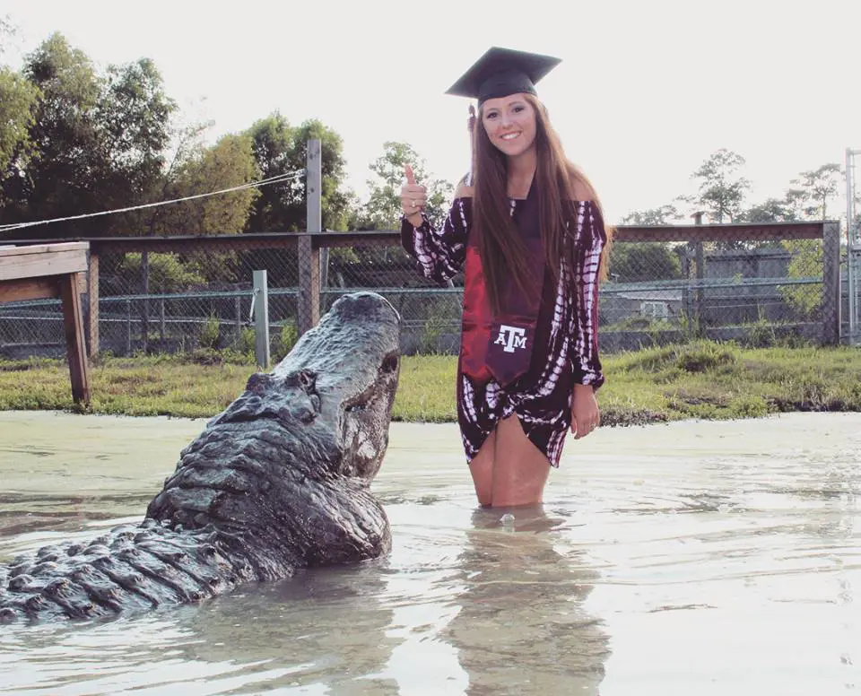 Makenzie Alex Noland's graduation photos featured a carnivorous cameo. 