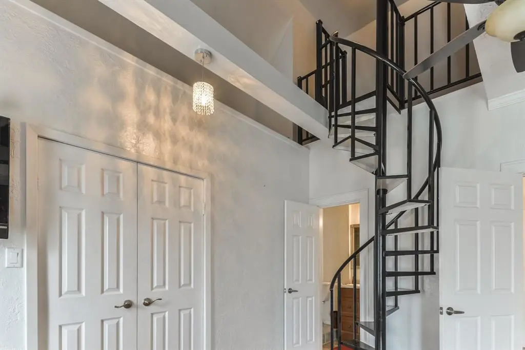 The spiral staircase leads to the loft. 