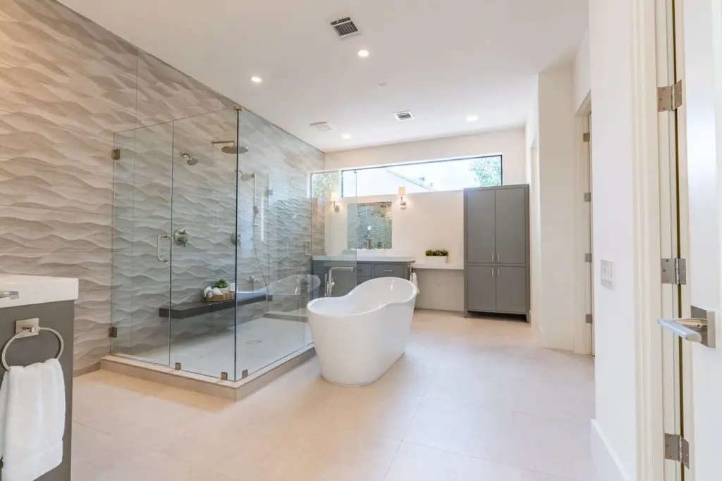The master bath features a free-standing soaking tub and separate shower. 