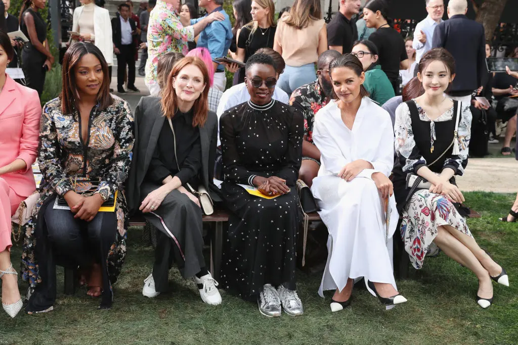 On the front row at Tory Burch, Julianne Moore and Danai  Gurira sport sneakers. Front left, Tiffany Haddish, Moore, Gurira, Katie Holmes, and Nazha. (Photo by Cindy Ord/Getty Images for Tory Burch)