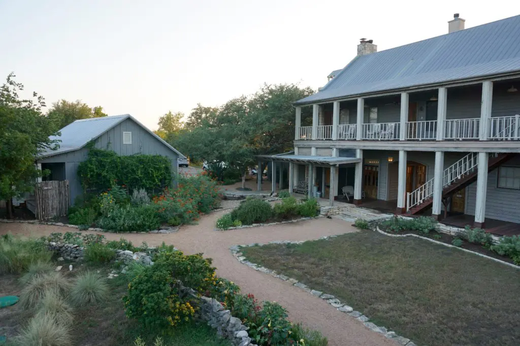 To the left is the garden spa and vegetable garden; to the right is the main farmhouse. 