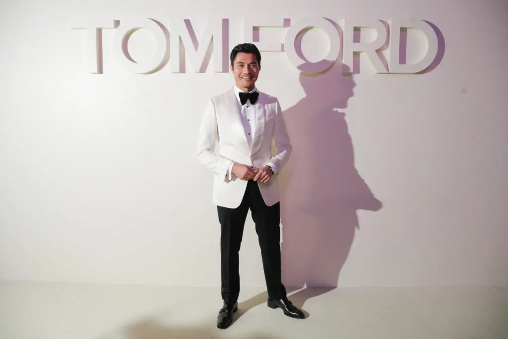 Celebrity Crowd Enjoys Tom Ford’s Kissing Booth at Fashion Week: Mischievous Designer Pulls Off a Sophisticated, Sexy Runway Show — and Henry Golding (and Others) Can’t Get Enough