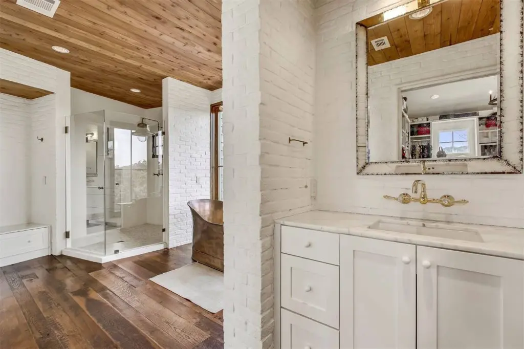 The bathroom includes an oversized shower. 