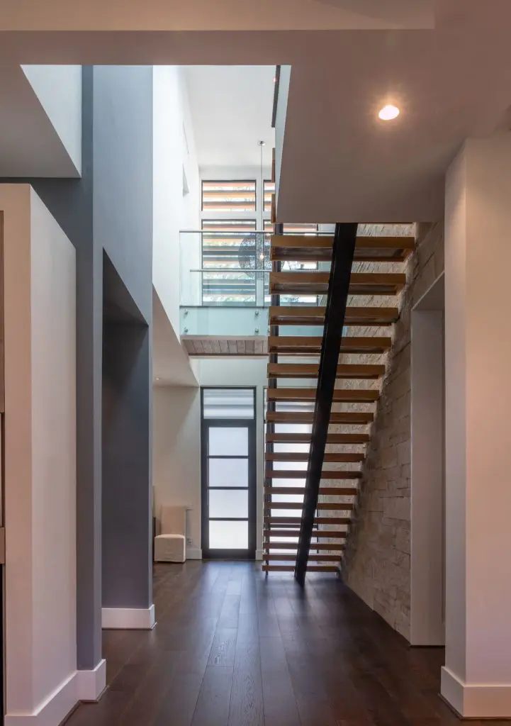 The double entry volume foyer at 1214 West Drew is accented with rustic touches. 