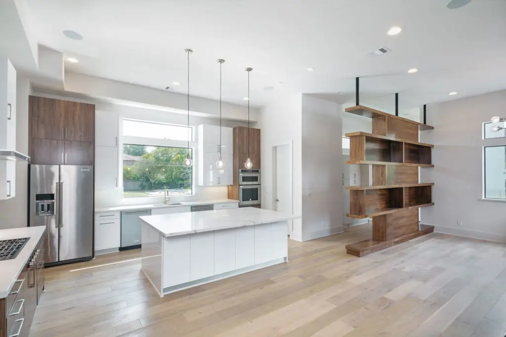 Innovative storage space separates the kitchen from the living room at 5003 Glenmeadow. 