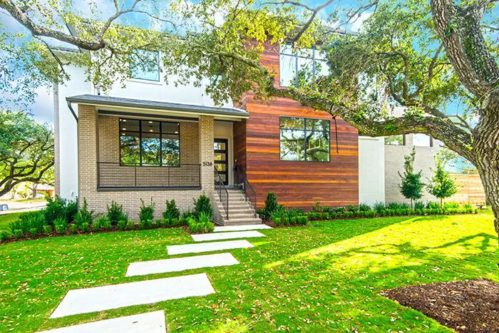 The ranch-style home at 5138 Glenmeadow has a unique collage facade. 