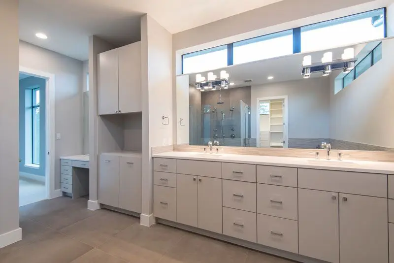 The luxurious master suite boasts his and hers walk in closets. 