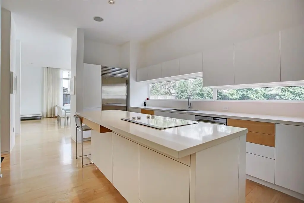 The kitchen at 6001 Charlotte is any chef's dream, with custom cabinetry, Bosh stainless appliances and Thassos Greek marble. 