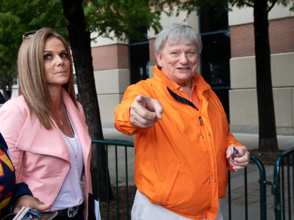 Super lawyer Rusty Hardin has no problem with a little pregame spotlight. Former sportscaster Patti Smith isn't so into it. (Photo by F. Carter Smith.)