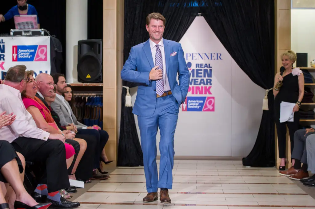 Bill Baldwin models for the Real Men Wear Pink kickoff party at M Penner in an in-store fashion show. On Saturday the fashions are in the parking lot.