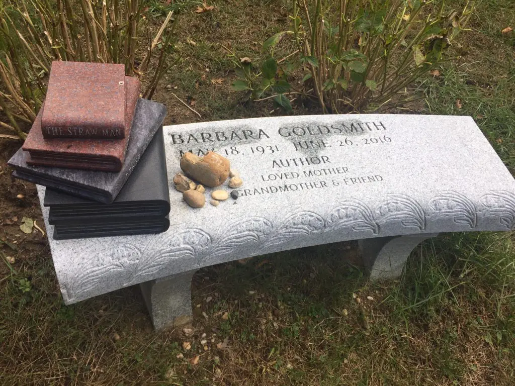 Writer Barbara Goldsmith's monument is unmistakable, bearing a stack of books she authored, rendered in stone. 