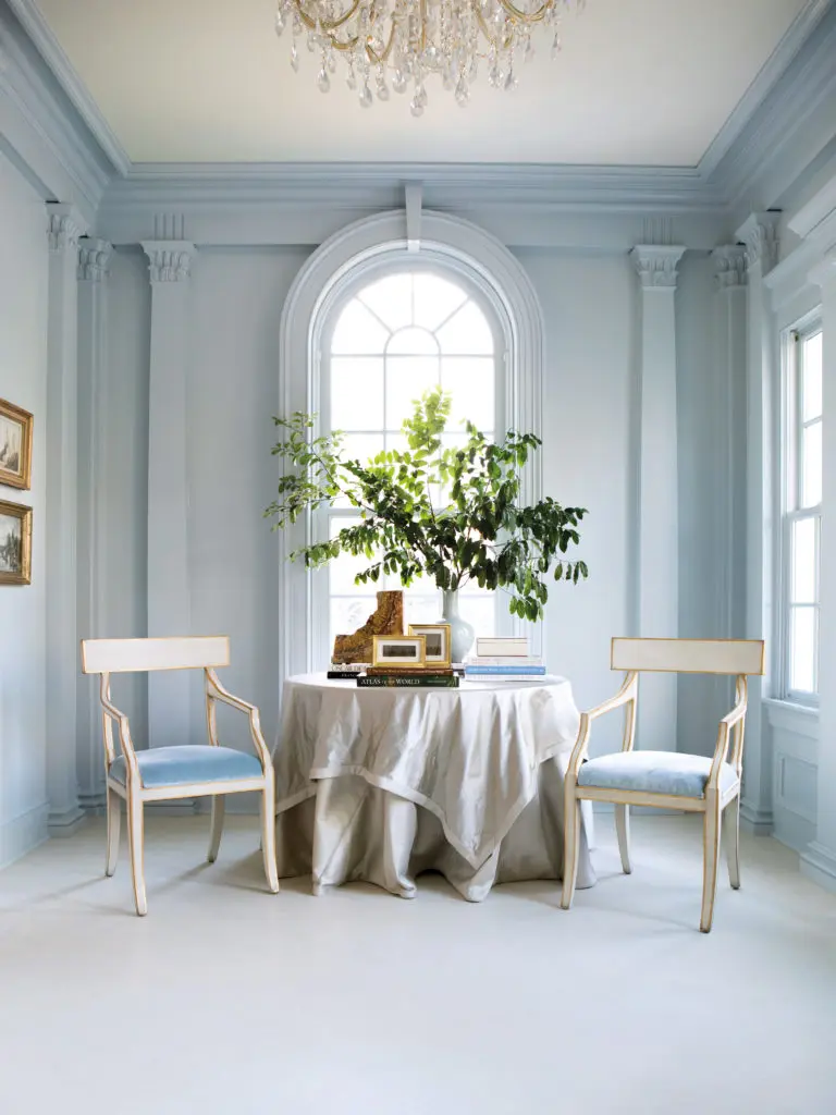 Painted the palest of pale blues, the new side entrace practically dissolves in the light. A project from Suzanne Kasler's new book. Photo by Erica George Dines.
