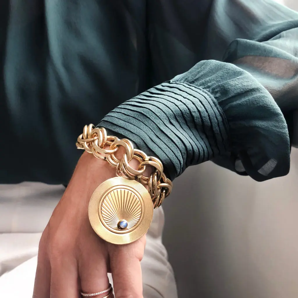A vintage bracelet showcasing one large charm is a modern take on a traditional look 