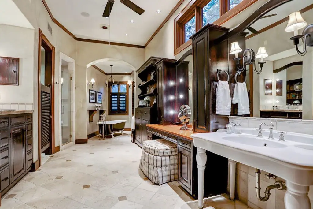 The master bath is a mix of contemporary and classic with wood accents. 