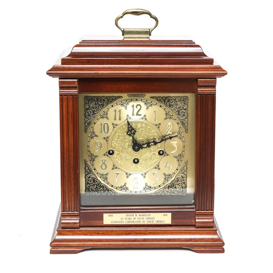 This Harrington House mantle clock features a cherry-colored case. 