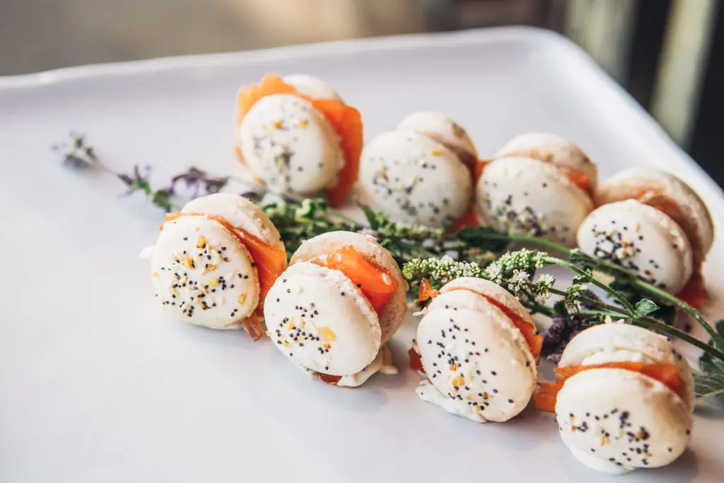 Wolfgang Puck flipped the switch on the macaron with a savory take, featuring house-smoked salmon and chive crème fraîche