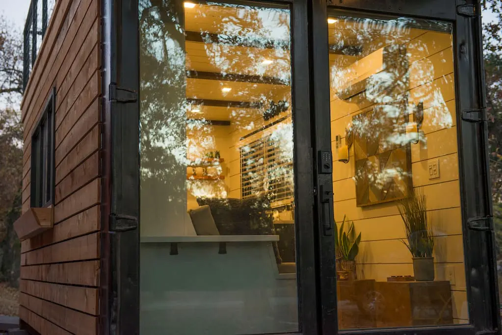 This innovative container home near Magnolia sleeps two people in a surprising custom Murphy bed. 