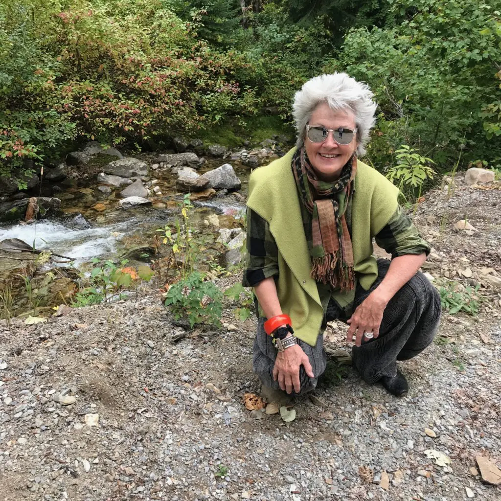 Stopping to listen to the rushing water and collect a few pebbles to bring back to Texas.