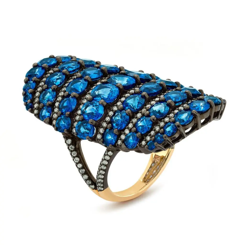 This Byzantine Mosaic Ring is inspired by travels from afar, with fancy shaped blue sapphires and diamonds arranged in alternating pattern atop an oval shaped saddle ring in 18K white gold with rhodium finish. (9.92 ctw. sapphire, 0.85 ctw. diamonds, $19,500)