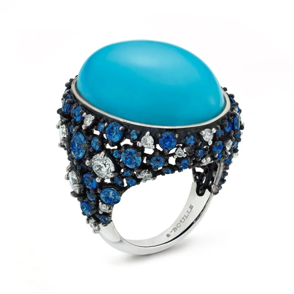 This stunner is a Robins Egg Blue Ring with turquoise, sapphires and diamonds in 18K white gold with blue finish. (31.58 ctw. natural cabochon oval turquoise with 3.72 ctw. sapphires and 1.76 ctw. round brilliant diamonds, $31,000)