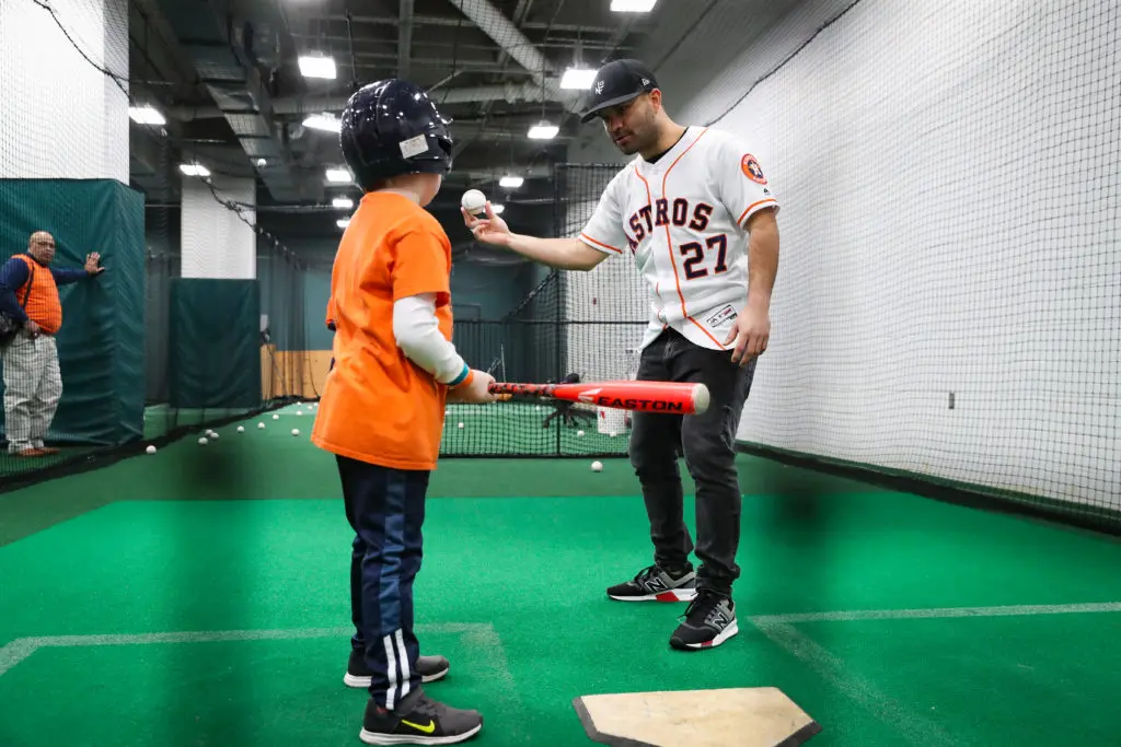 Jose Altuve gave a young fan some batting tips at the Astros' FanFest.