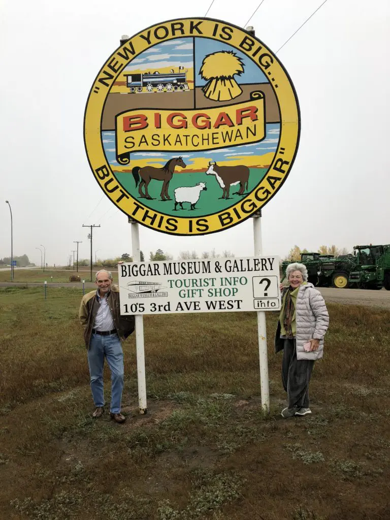 My brother John Thompson and I pose under this sign that announces, "NY is Big, But This Is Biggar." (Photo by Mary Margaret Hansen)