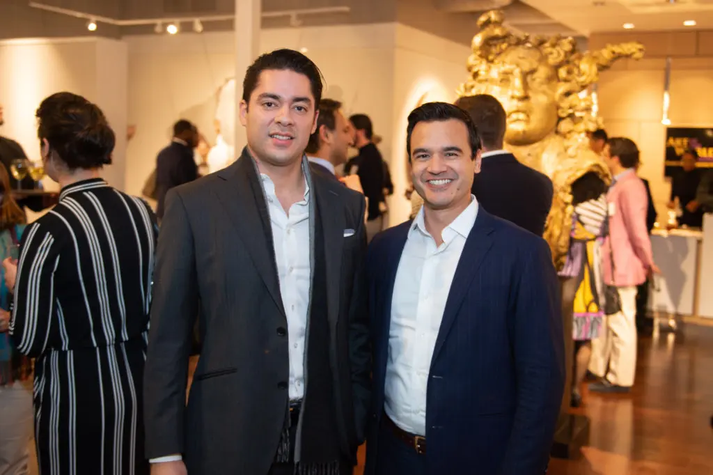 Alan Rios and Garreth DeVoe at the Houston Symphony Young Associates Council party at Art of the World Gallery (Photo by Wilson Parish)